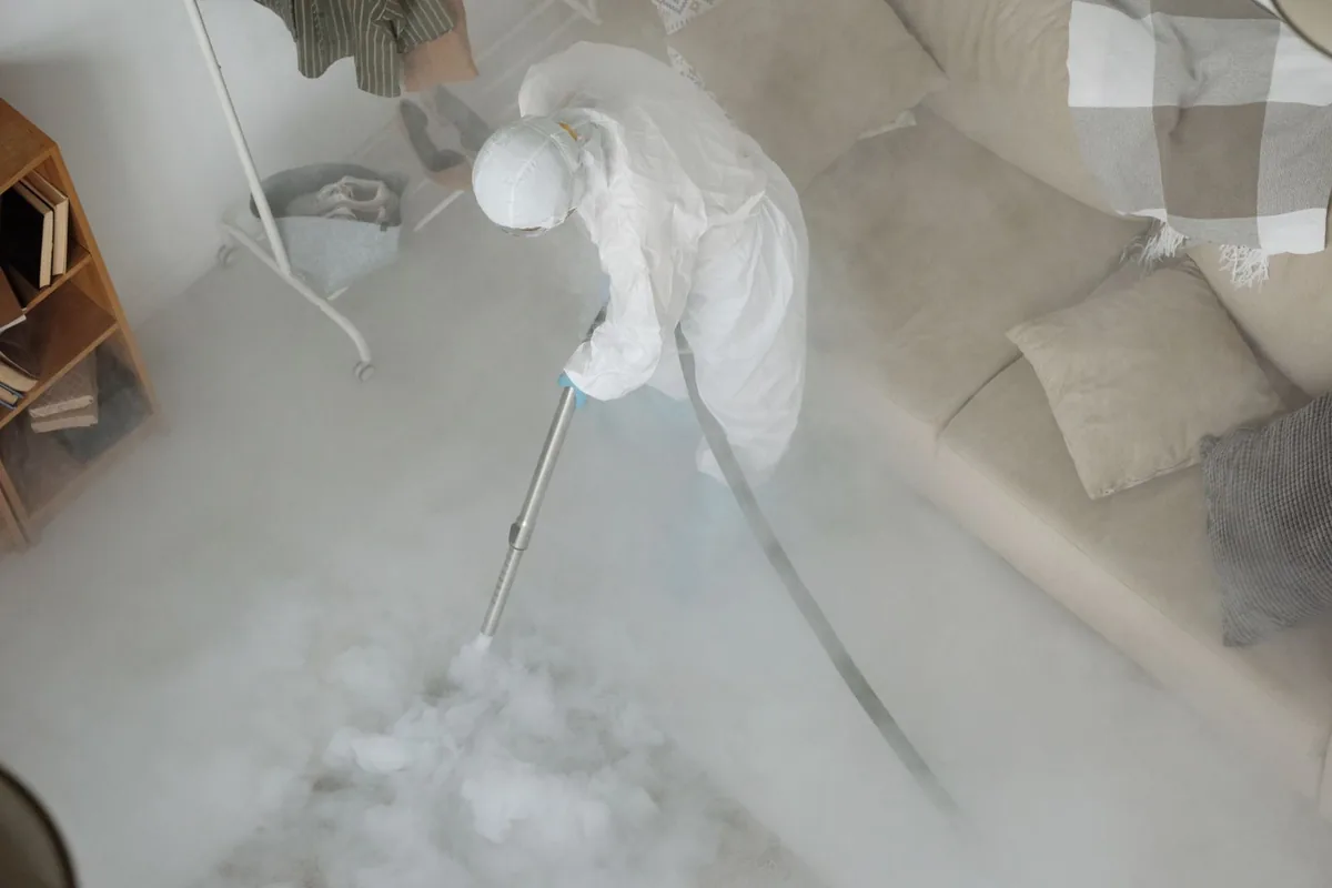 Biohazard cleanup technician in protective equipment, Pine Island Center, FL